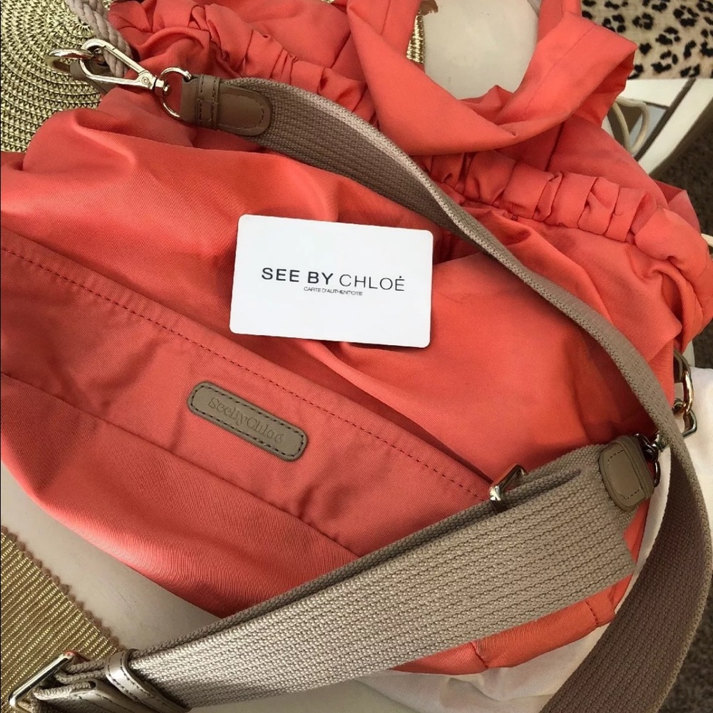 See by Chloé top handle and cross body coral bag